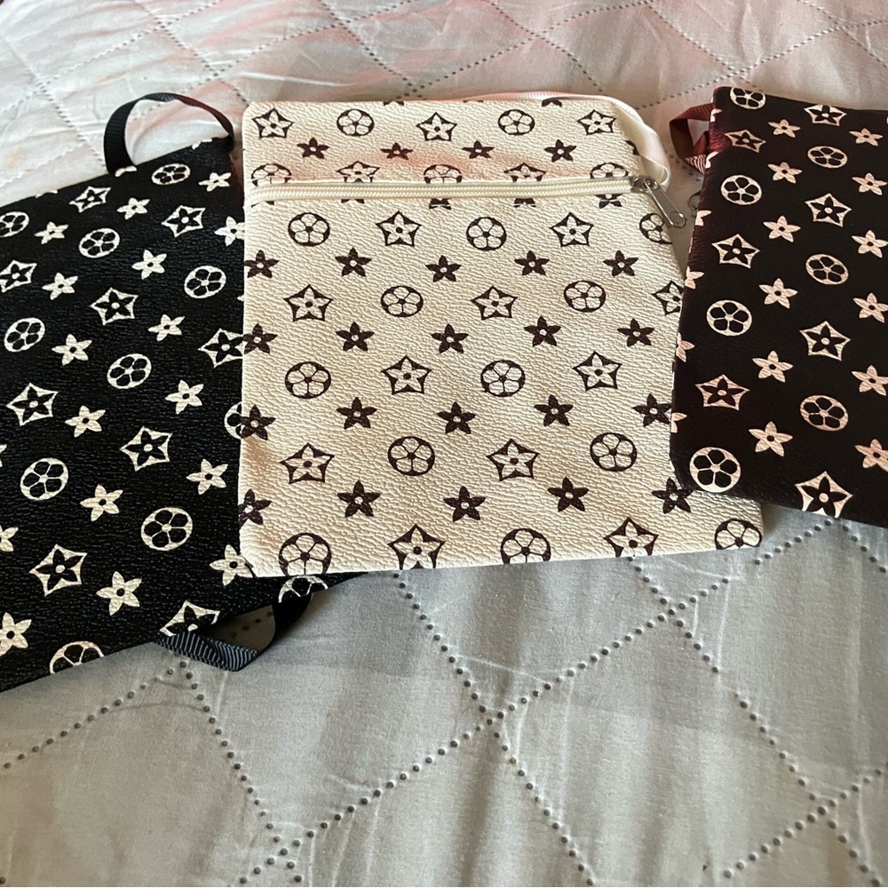 Fashion Nova Black and Cream Star Pattern Bags